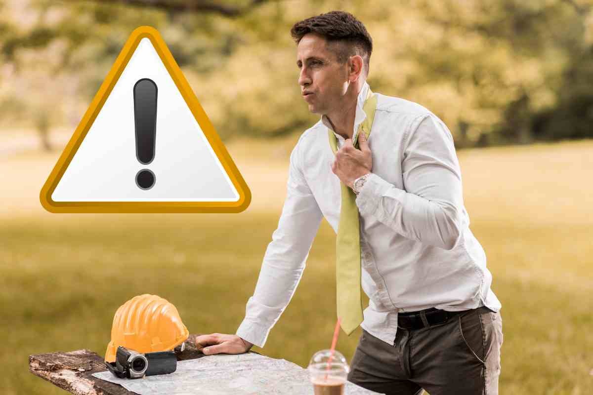 Uomo accaldato e segnale pericolo
